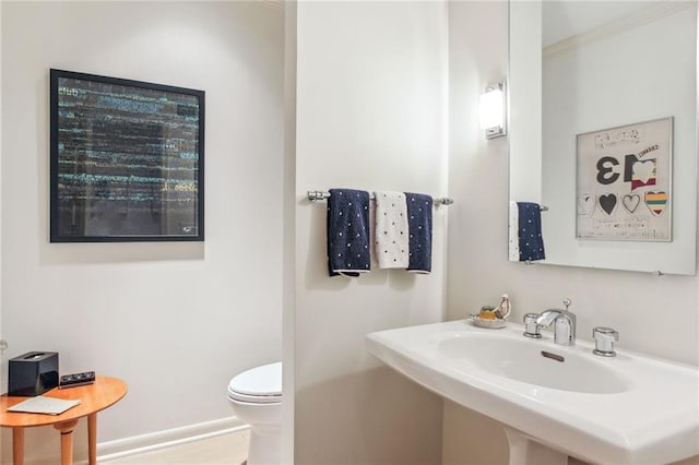 bathroom with a sink and toilet