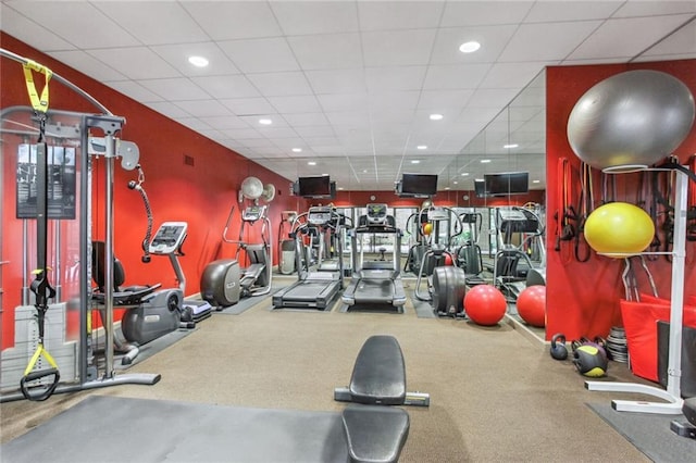 gym featuring a drop ceiling and recessed lighting