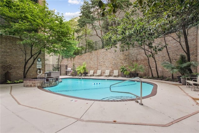 community pool featuring a patio area