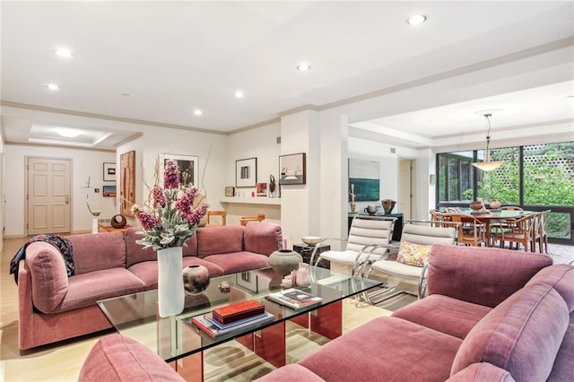 living room featuring ornamental molding and recessed lighting