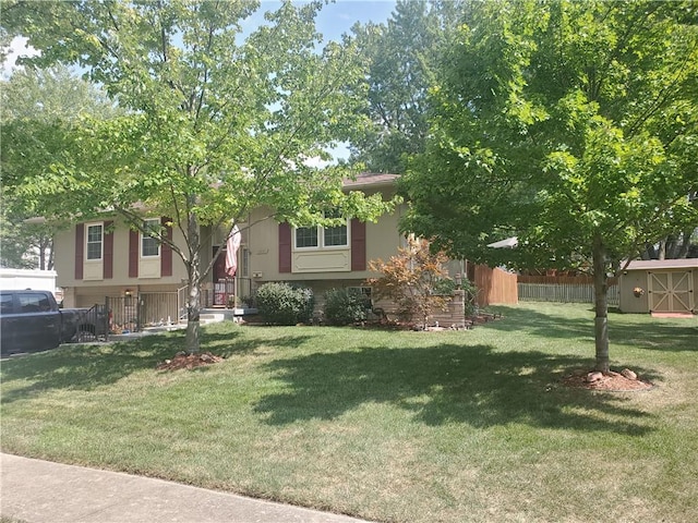 view of front facade with a front lawn and a shed