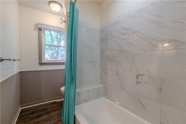 bathroom with shower / bath combo with shower curtain, toilet, and hardwood / wood-style flooring