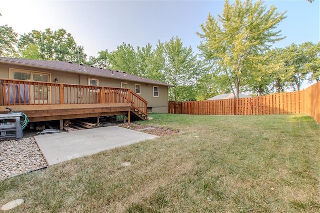 view of yard with a patio area and a deck