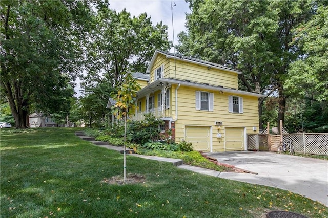 view of front of property with a garage and a front yard