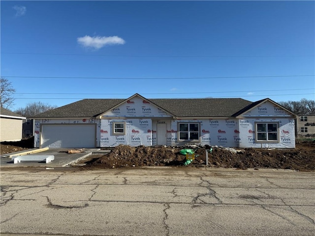 property in mid-construction with a garage