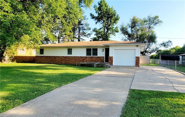 ranch-style house with a garage and a front lawn