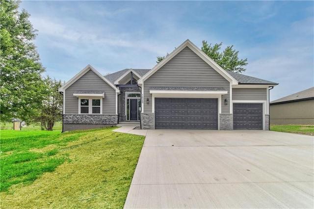 view of front facade with a front lawn and a garage