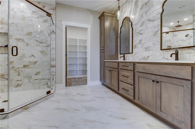 bathroom with an enclosed shower and vanity