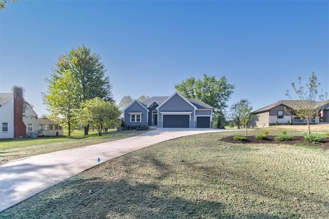 ranch-style home featuring a garage and a front yard