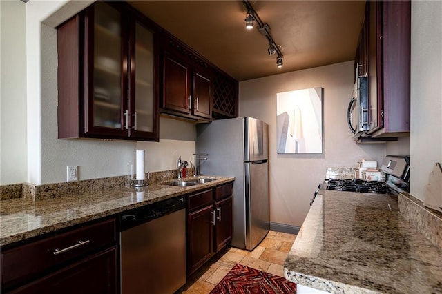 700 E 8th St Unit 11P, Kansas City, MO 64106 - kitchen with appliances with stainless steel finishes, a sink, stone counters, glass insert cabinets, and stone tile flooring