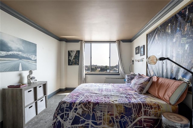 bedroom with ornamental molding and carpet floors