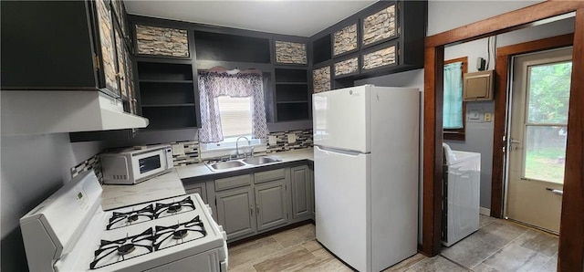 kitchen featuring white appliances, a sink, light countertops, gray cabinets, and open shelves