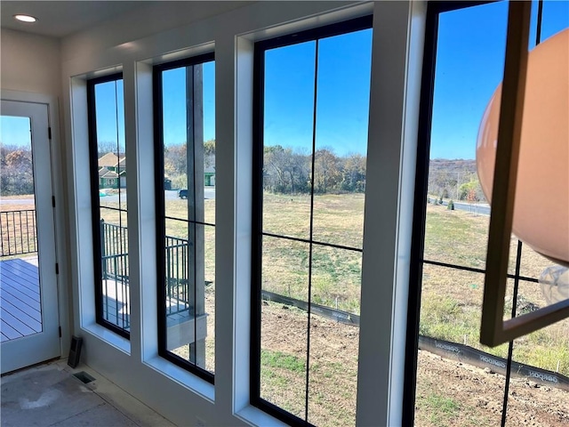 doorway to outside featuring visible vents