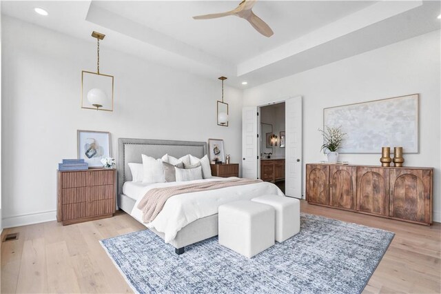1816 NE Lashbrook Cir, Lees Summit, MO 64086 - bedroom with a tray ceiling, light wood-type flooring, and recessed lighting