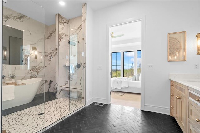1816 NE Lashbrook Cir, Lees Summit, MO 64086 - bathroom featuring ensuite bathroom, a marble finish shower, vanity, a freestanding bath, and baseboards