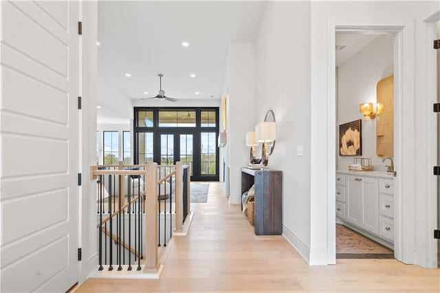 1816 NE Lashbrook Cir, Lees Summit, MO 64086 - hall featuring recessed lighting, light wood-style floors, baseboards, and an upstairs landing