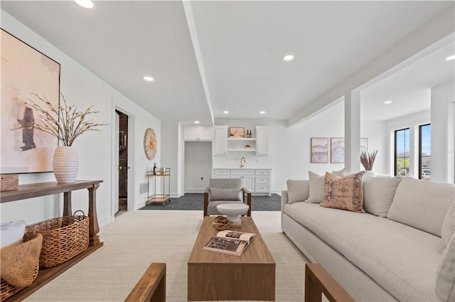 1816 NE Lashbrook Cir, Lees Summit, MO 64086 - carpeted living area with recessed lighting, baseboards, and a sink