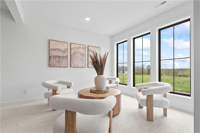 1816 NE Lashbrook Cir, Lees Summit, MO 64086 - sitting room featuring light carpet, visible vents, recessed lighting, and a healthy amount of sunlight