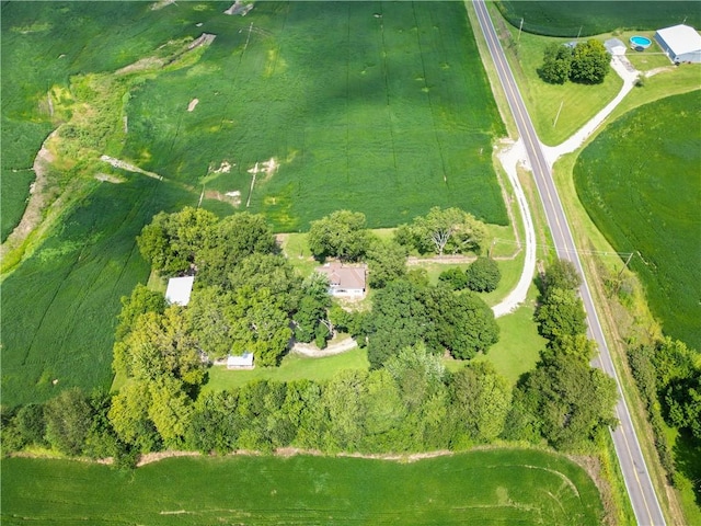 birds eye view of property with a rural view