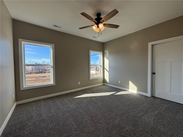 carpeted empty room with ceiling fan