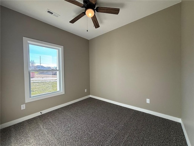 spare room with ceiling fan and carpet floors