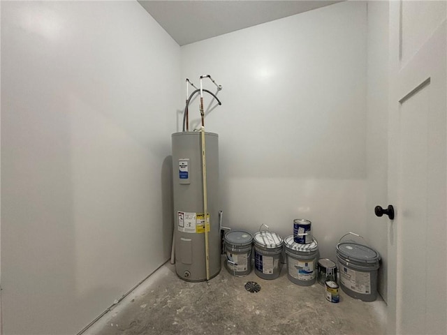 utility room with electric water heater