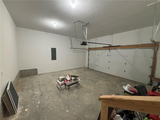 garage featuring a garage door opener and electric panel