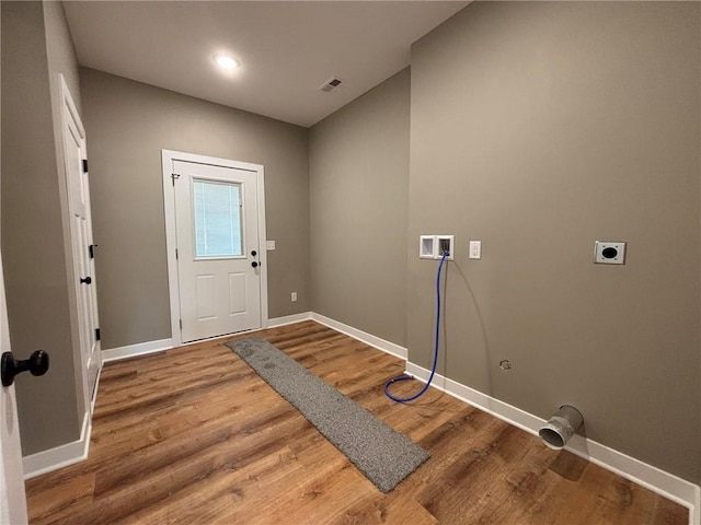 laundry area with electric dryer hookup, washer hookup, and wood-type flooring