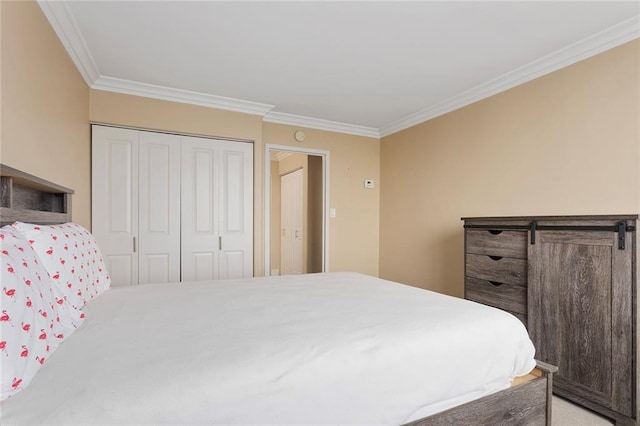 bedroom featuring a closet, crown molding, and a barn door