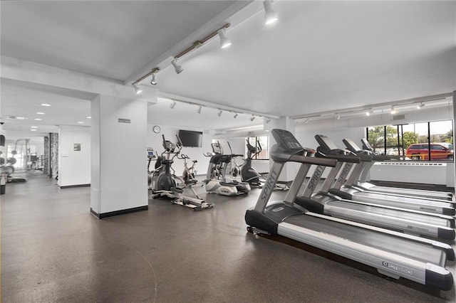 gym featuring track lighting