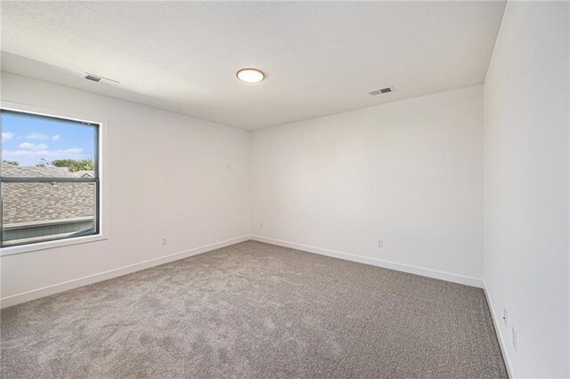 empty room featuring carpet flooring