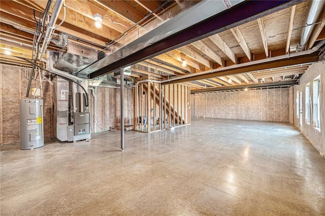 basement featuring heating unit and water heater