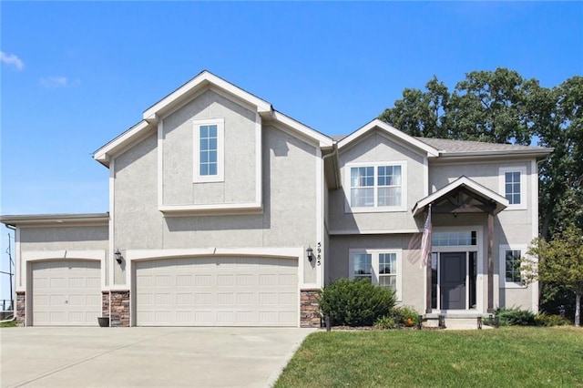 view of front of house featuring a front lawn and a garage