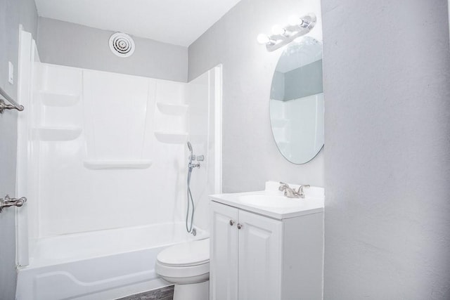 bathroom with visible vents, shower / bath combination, vanity, and toilet