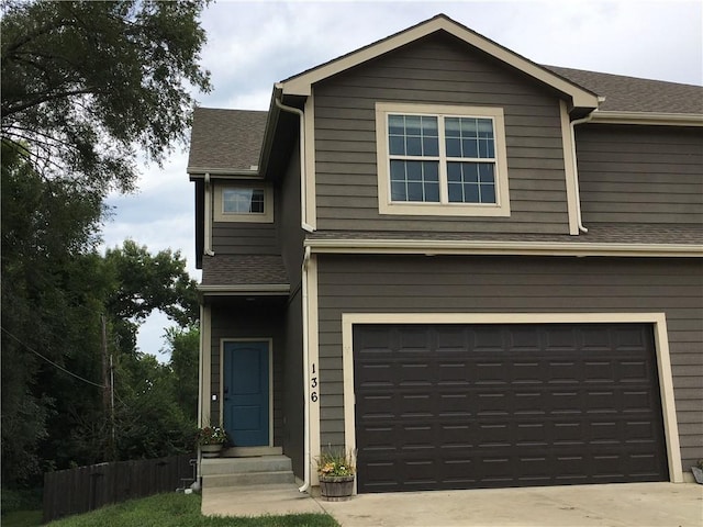 view of front of property with a garage