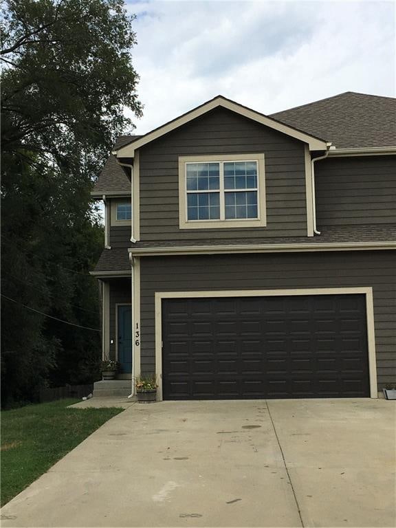 view of front of property with a garage