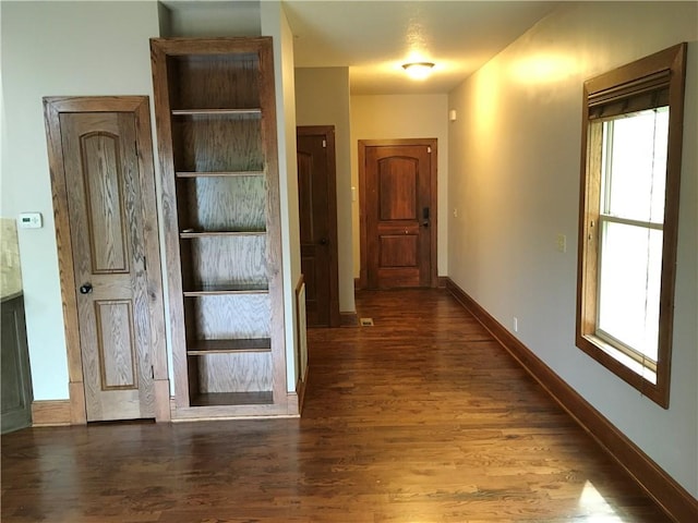 hallway featuring dark hardwood / wood-style floors