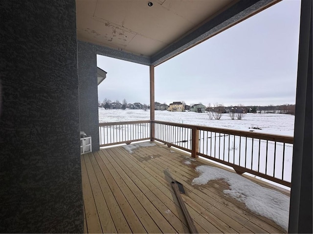 view of snow covered deck