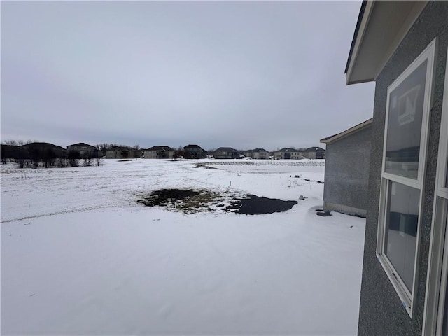 view of yard covered in snow