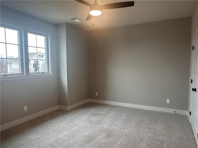 unfurnished room featuring carpet floors and ceiling fan