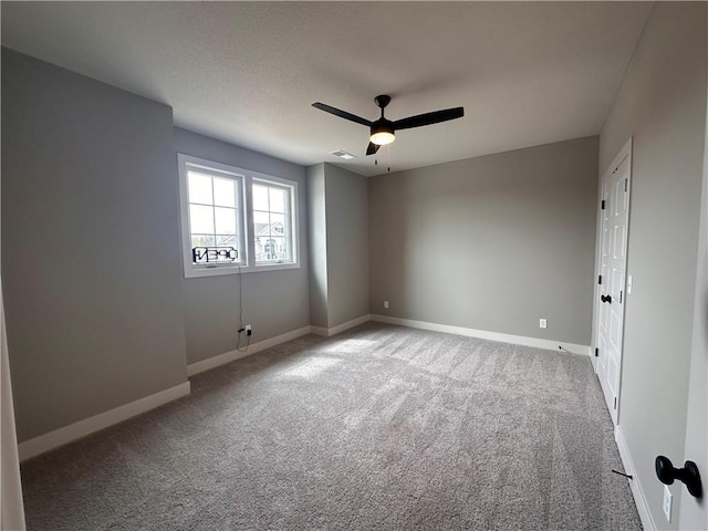2007 Foxtail Pt, Kearney, MO 64060 - carpeted empty room featuring baseboards and a ceiling fan