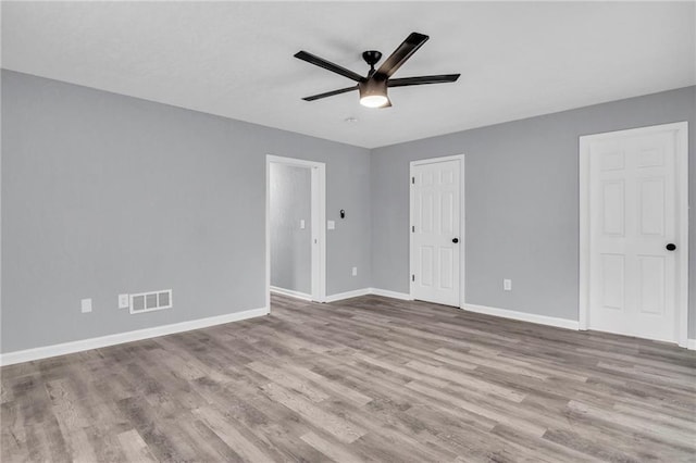 unfurnished bedroom with hardwood / wood-style flooring and ceiling fan