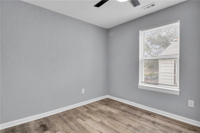 unfurnished room featuring ceiling fan and hardwood / wood-style floors