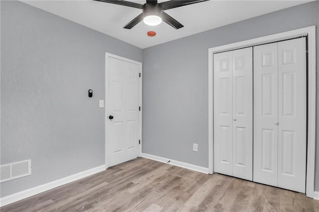 6825 Walrond Ave, Kansas City, MO 64132 - unfurnished bedroom featuring light wood-style floors, a closet, baseboards, and a ceiling fan