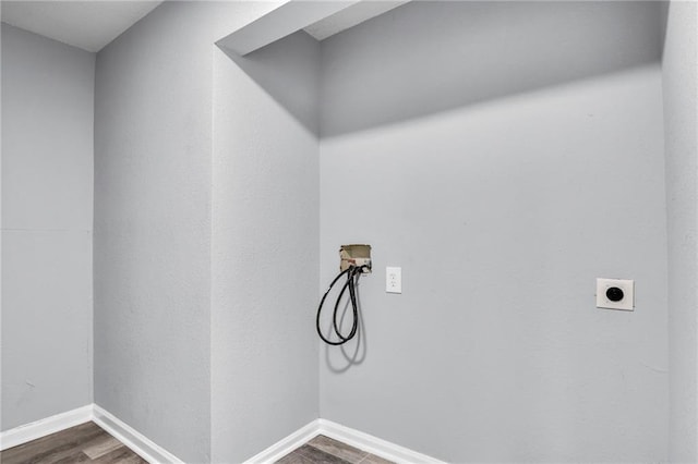 6825 Walrond Ave, Kansas City, MO 64132 - washroom with electric dryer hookup, hookup for a washing machine, dark wood-type flooring, and baseboards