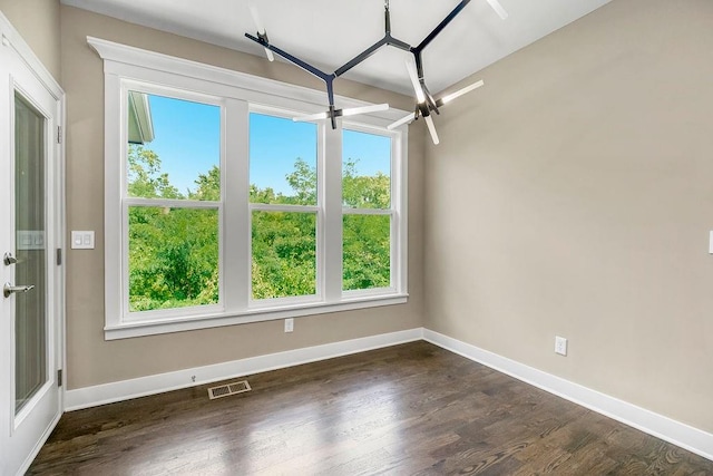 empty room featuring dark wood-type flooring