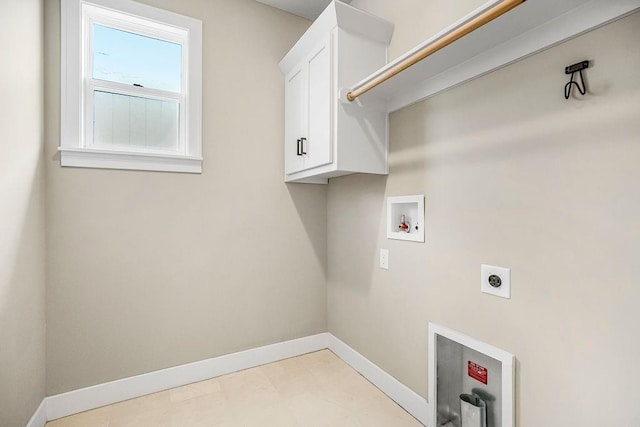 laundry room featuring light tile patterned flooring, electric dryer hookup, cabinets, and hookup for a washing machine