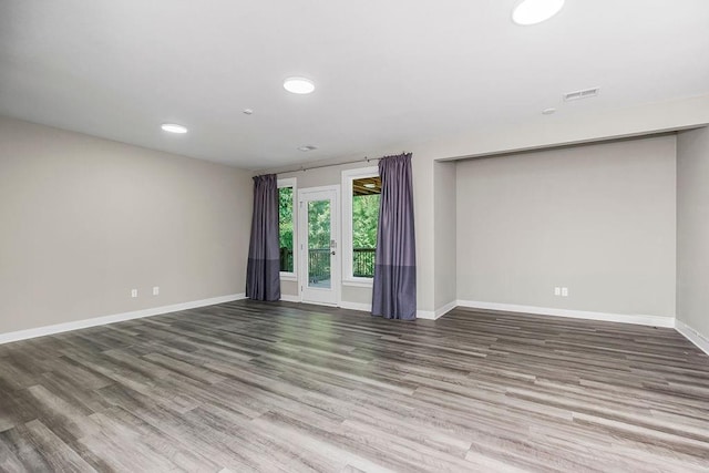 unfurnished room featuring wood-type flooring