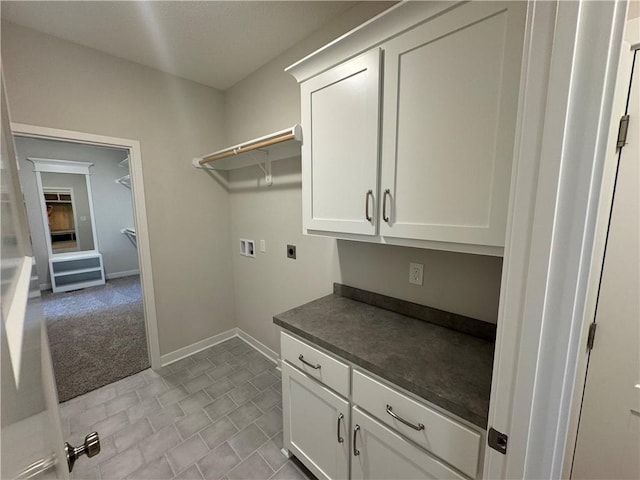 laundry area featuring cabinets, hookup for a washing machine, and electric dryer hookup