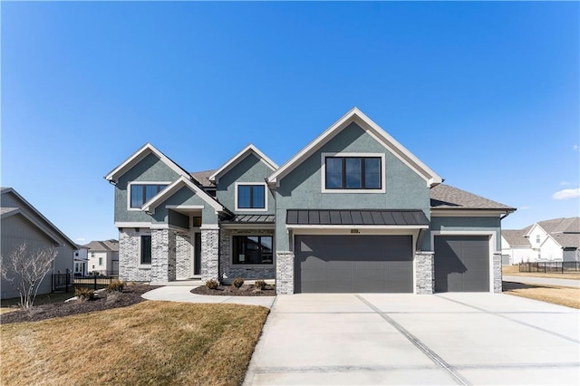 view of front of house featuring concrete driveway, a front yard, a standing seam roof, fence, and metal roof